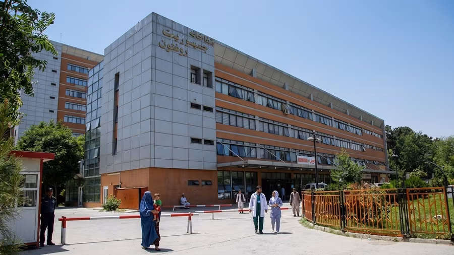 Exterior of Jamhuriat Hospital, a government hospital in Kabul, with Dari signage above the entrance